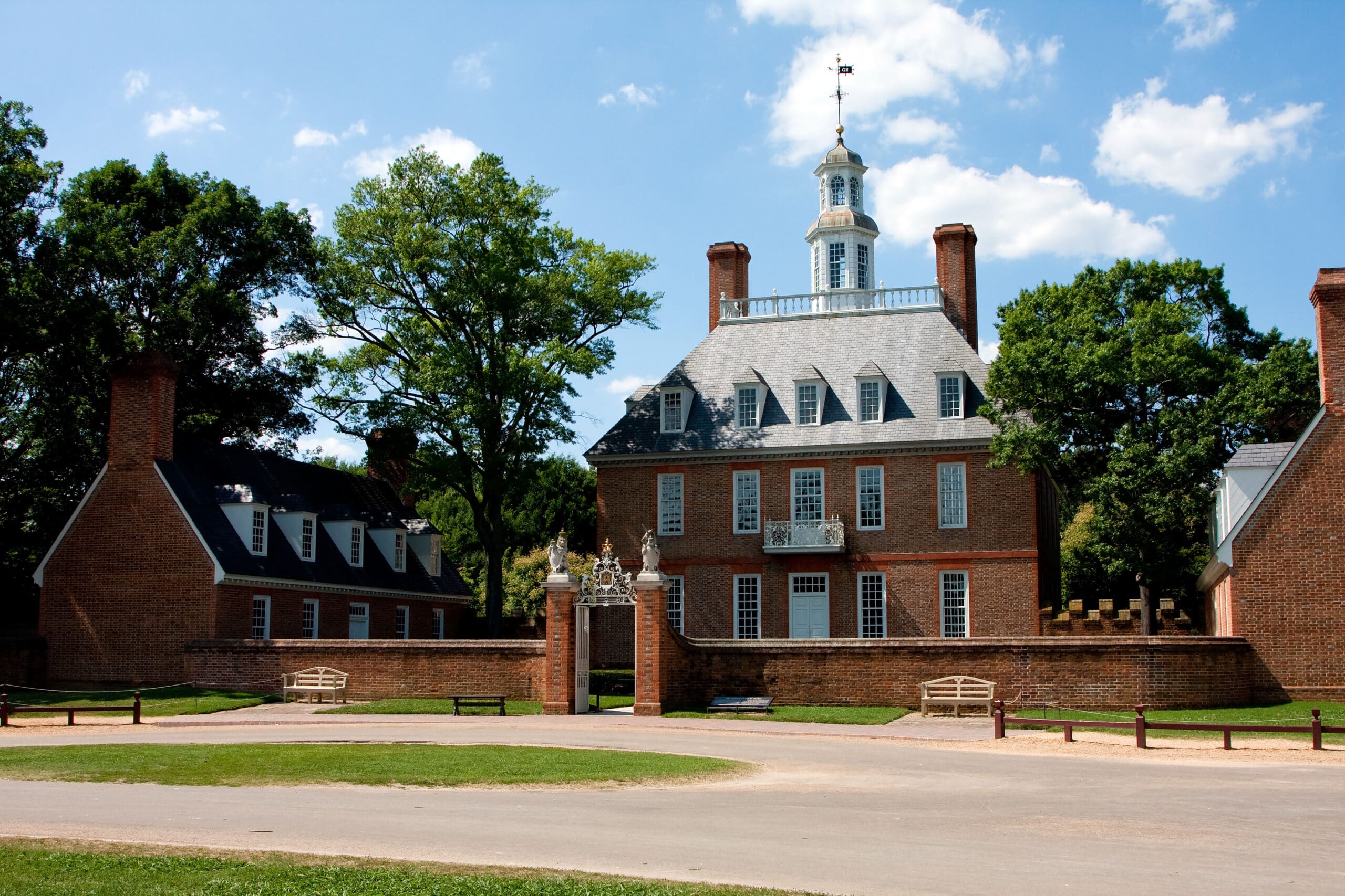 The Governor's Palace in Colonial Williamsburg, Virginia. A brick Colonial house with a courtyard, and former home of Thomas Jefferson.